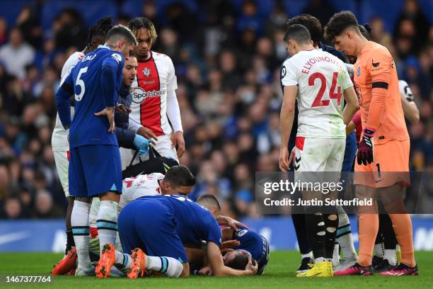 Cesar Azpilicueta of Chelsea lies injured during the Premier League match between Chelsea FC and Southampton FC at Stamford Bridge on February 18,...