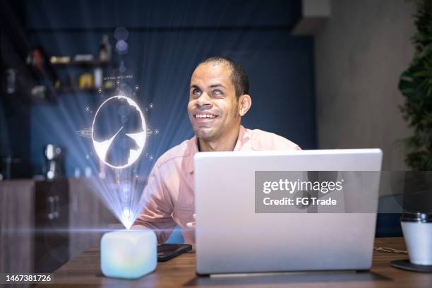 visually impaired man using the laptop and digital intelligence in the office - description stockfoto's en -beelden