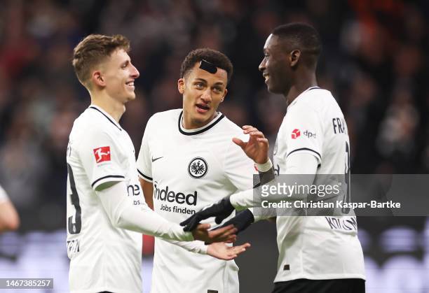 Randal Kolo Muani of Eintracht Frankfurt celebrates after scoring the team's second goal with teammates during the Bundesliga match between Eintracht...