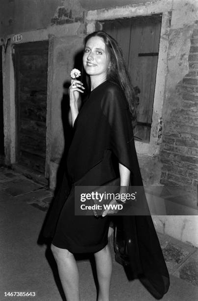 Marie Brandolini AKA Countess Marie Brandolini d'Adda di Valmareno holds flower given by attendants during dinner party after 'Made in Milan' film...