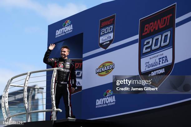 Frankie Muniz, driver of the Hair Club Ford, walks onstage during driver intros prior to prior to the ARCA Menards Series Race at Daytona...