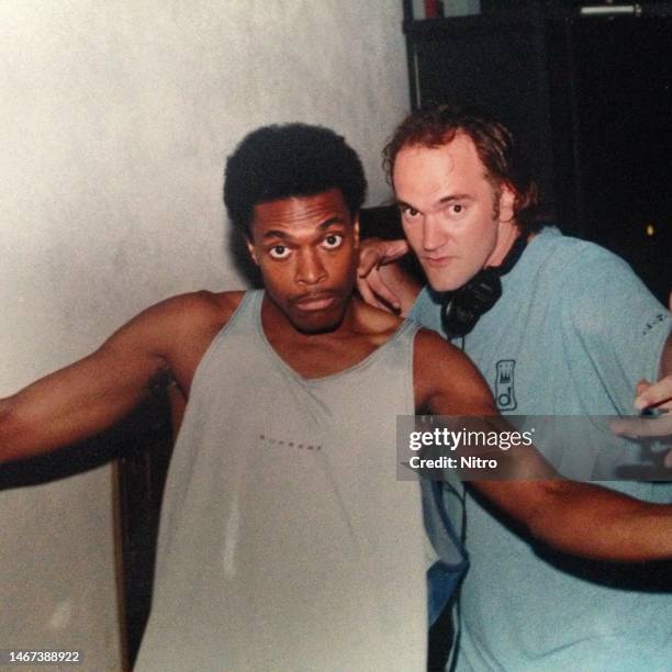 American comedian & actor Chris Tucker and film director Quentin Tarantino pose on set of their film 'Jackie Brown,' Los Angeles California, circa...