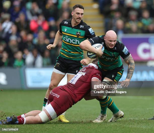 Aaron Hinkley of Northampton Saints is tackled by Cobus Wiese during the Gallagher Premiership Rugby match between Northampton Saints and Sale Sharks...