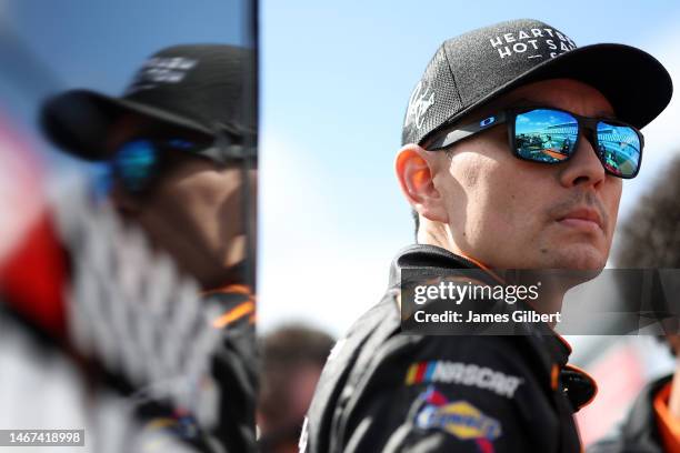 Ryan Ellis, driver of the Heartbeat Hot Sauce Chevrolet, walks the grid during qualifying for the Beef. It's What's For Dinner. 300 at Daytona...