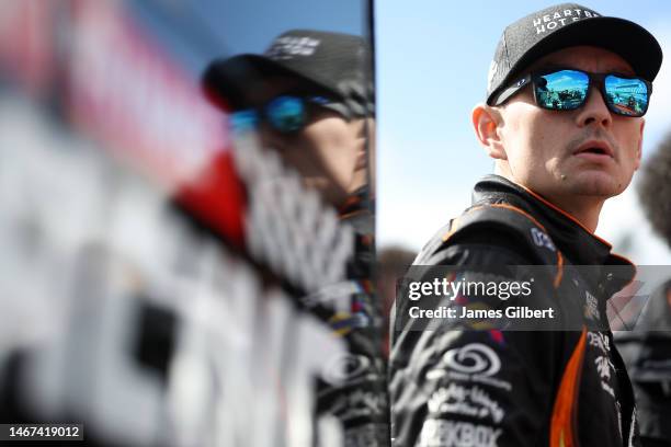 Ryan Ellis, driver of the Heartbeat Hot Sauce Chevrolet, walks the grid during qualifying for the Beef. It's What's For Dinner. 300 at Daytona...