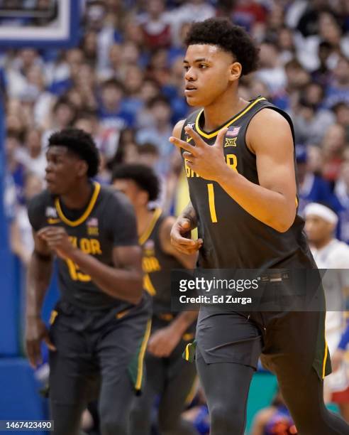 Keyonte George of the Baylor Bears celebrates a basket against the Kansas Jayhawks in the first half of the game at Allen Fieldhouse on February 18,...