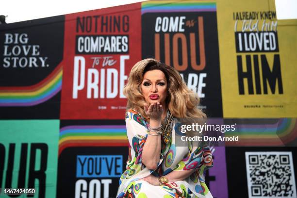 Drag Icon Penny D poses in front of the "Big Love Stories" mural as part of Sydney WorldPride in Redfern on February 18, 2023 in Sydney, Australia.