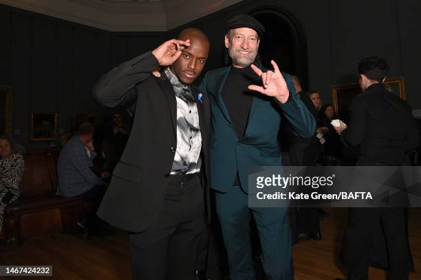 Troy Kotsur and Micheal Ward attend the BAFTA Film Awards 2023 Nominees Party supported by Bulgari at The National Gallery on February 18, 2023 in...