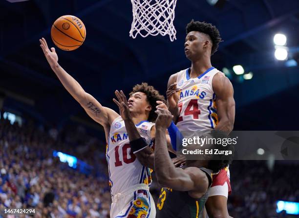 Jalen Wilson of the Kansas Jayhawks tries to rebound against teammate K.J. Adams Jr. #24 and Jonathan Johnathan Tchamwa Tchatchoua of the Baylor...