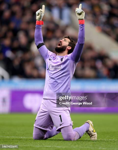 Alisson Becker of Liverpool celebrates after the team's first goal during the Premier League match between Newcastle United and Liverpool FC at St....