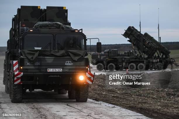 German soldier drives a M983 HEMTT carrying a Patriot launcher module part of the US made MIM-104 Patriot surface-to-air missile system on a open...