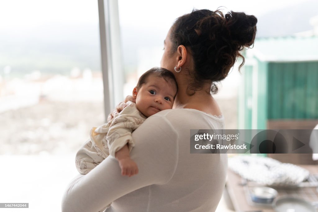 Mother holding her baby in her arms