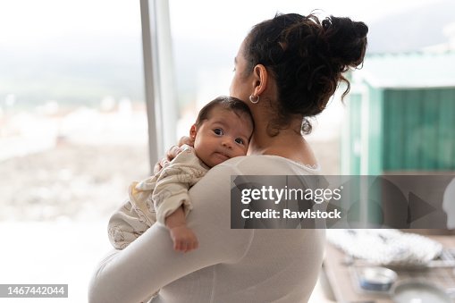 Mother holding her baby in her arms