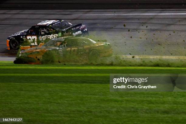 Sammy Smith, driver of the TMC Toyota, spins into the infield grass after an on-track incident with Jeb Burton, driver of the State Water Heaters...