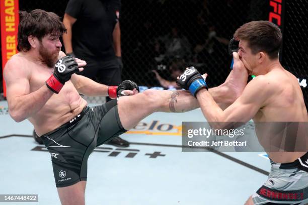 Jim Miller kicks Alexander Hernandez in a lightweight fight during the UFC Fight Night event at UFC APEX on February 18, 2023 in Las Vegas, Nevada.