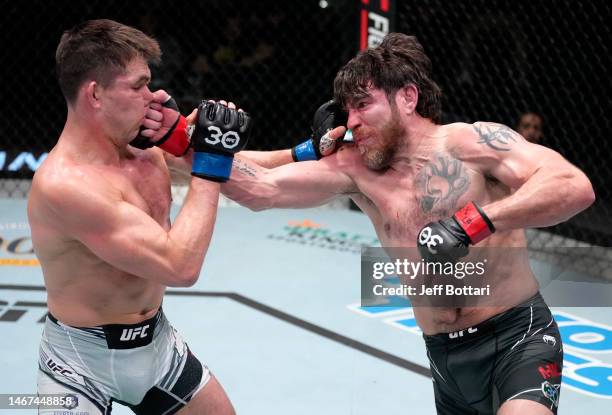 Jim Miller punches Alexander Hernandez in a lightweight fight during the UFC Fight Night event at UFC APEX on February 18, 2023 in Las Vegas, Nevada.