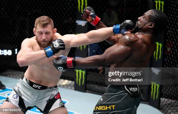 Marcin Prachnio of Poland punches William Knight in a light heavyweight fight during the UFC Fight Night event at UFC APEX on February 18, 2023 in...