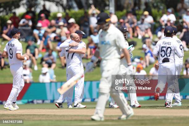 Jack Leach and Ben Stokes of England celebrate the wicket of Michael Bracewell of New Zealand during day four of the First Test match in the series...