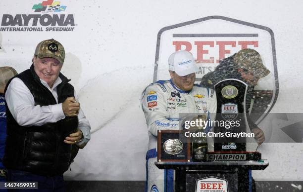 Austin Hill, driver of the Bennett Transportation Chevrolet, and RCR Team Owner, Richard Childress celebrate by spraying champagne in victory lane...