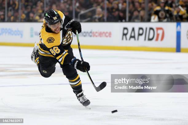 David Pastrnak of the Boston Bruins takes a shot against the New York Islanders during the first period at TD Garden on February 18, 2023 in Boston,...