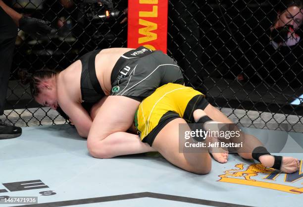 Erin Blanchfield secures a rear choke submission against Jessica Andrade of Brazil in a flyweight fight during the UFC Fight Night event at UFC APEX...