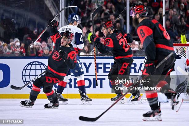 Seth Jarvis of the Carolina Hurricanes celebrates after a goal is scored by teammate Martin Necas during the second period against the Washington...