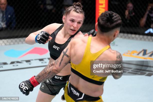 Erin Blanchfield punches Jessica Andrade of Brazil in a flyweight fight during the UFC Fight Night event at UFC APEX on February 18, 2023 in Las...