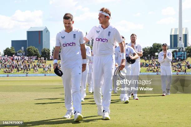 James Anderson and Stuart Broad of England leave the field followin day four of the First Test match in the series between New Zealand and England at...