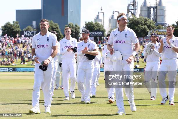 James Anderson and Stuart Broad of England leave the field followin day four of the First Test match in the series between New Zealand and England at...