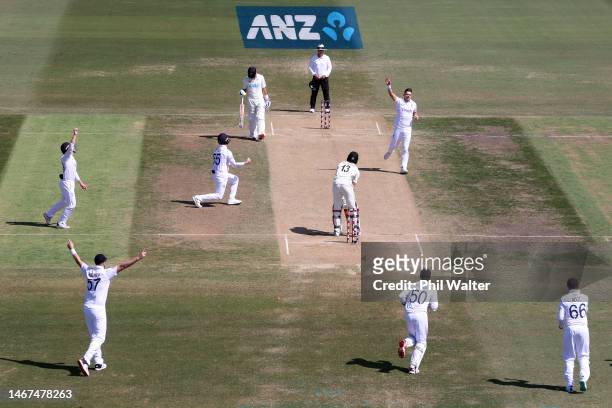 James Anderson of England celebrates the final wicket of Blair Tickner of New Zealand to win the test during day four of the First Test match in the...