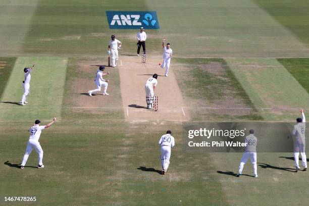 James Anderson of England celebrates the final wicket of Blair Tickner of New Zealand to win the test during day four of the First Test match in the...