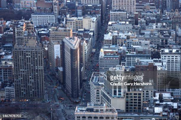 Traffic moves along 5th Avenue past the Flatiron Building seen from the 86th-floor observation deck of the Empire State Building on February 18 in...