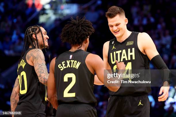 Collin Sexton, Walker Kessler, and Jordan Clarkson of the Utah Jazz react in the 2023 NBA All Star KIA Skills Challenge at Vivint Arena on February...