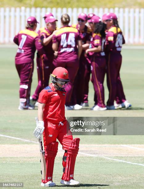 Bridget Patterson of the Scorpions walks after getting out for 5 runs. Caught Laura Harris of Queensland off the bowling of Nicola Hancock of...