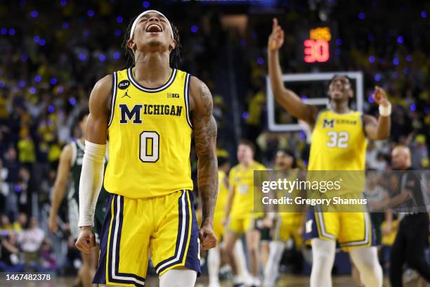 Dug McDaniel of the Michigan Wolverines reacts in the second half while playing the Michigan State Spartans at Crisler Arena on February 18, 2023 in...