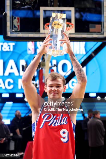 Mac McClung of the Philadelphia 76ers poses with the trophy after winning the 2023 NBA All Star AT&T Slam Dunk Contest at Vivint Arena on February...