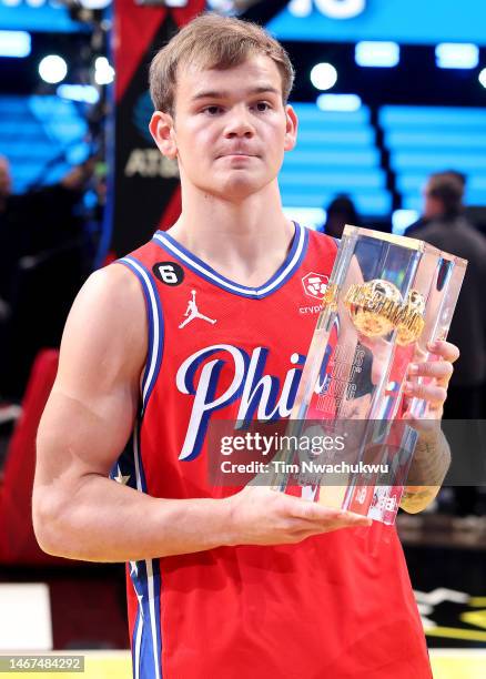 Mac McClung of the Philadelphia 76ers poses with the trophy after winning the 2023 NBA All Star AT&T Slam Dunk Contest at Vivint Arena on February...