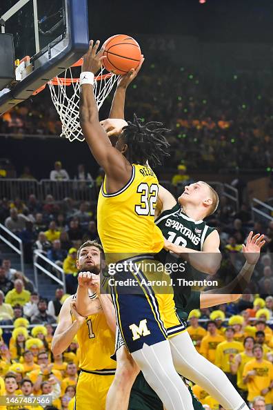 Tarris Reed Jr. #32 of the Michigan Wolverines attempts a layup... News ...