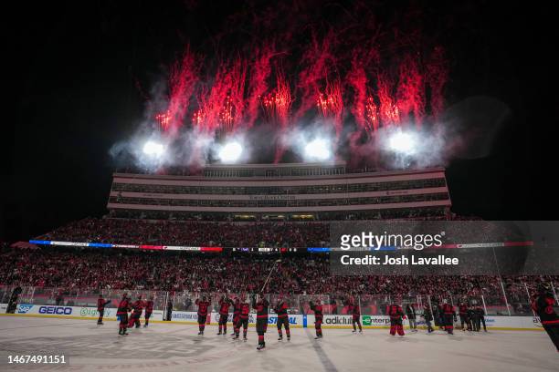 The Carolina Hurricanes celebrate after defeating the Washington Capitals in the 2023 Navy Federal Credit Union NHL Stadium Series game at...