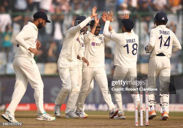 Ravindra Jadeja of India celebrates taking the wicket of Peter Handscomb of Australia during day three of the Second Test match in the series between...