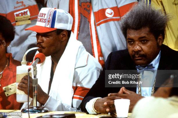 Boxer Champion Larry Holmes is joined by Don King at post-fight press conference following Championship Fight, May 20, 1983 in Las Vegas, Nevada....