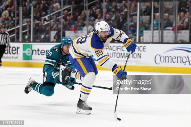 Alex Tuch of the Buffalo Sabres gets past Timo Meier of the San Jose Sharks to score an empty-net goal in the third period at SAP Center on February...