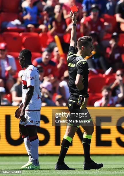 Referee Johnathan Barreiro gives a red card to Adama Traore of the Wanderers during the round 17 A-League Men's match between Adelaide United and...