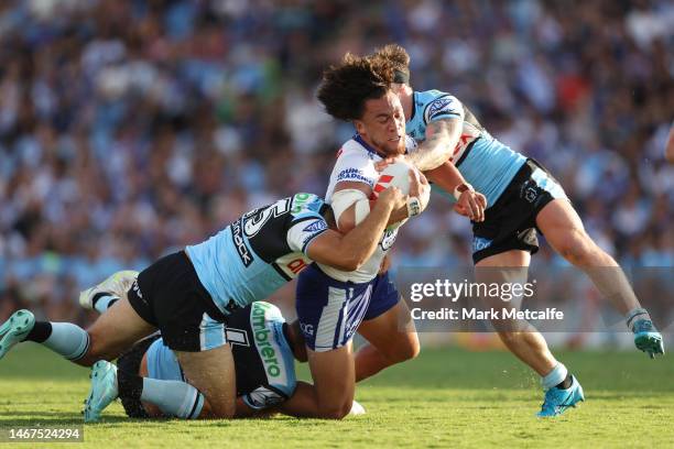 Raymond Faitala-Mariner of the Bulldogs is tackled during the NRL Trial Match between the Canterbury Bulldogs and the Cronulla Sharks at Belmore...