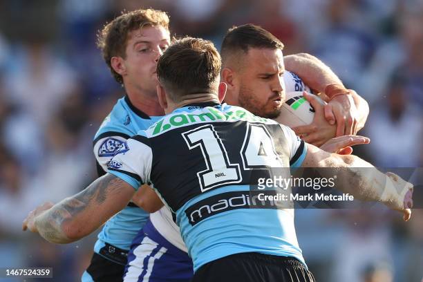 Josh Reynolds of the Bulldogs is tackled during the NRL Trial Match between the Canterbury Bulldogs and the Cronulla Sharks at Belmore Sports Ground...