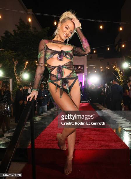Lindsey Pelas poses at the MAXIM Carnival Mardi Gras celebration at EDEN Sunset on February 18, 2023 in Los Angeles, California.