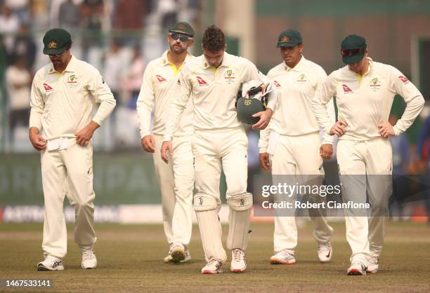 The Australian team walk off after they were defeated by India during day three of the Second Test match in the series between India and Australia at...
