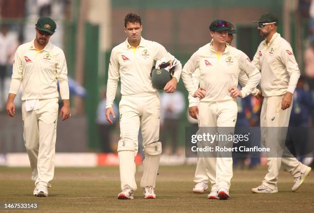 The Australian team walk off after they were defeated by India during day three of the Second Test match in the series between India and Australia at...