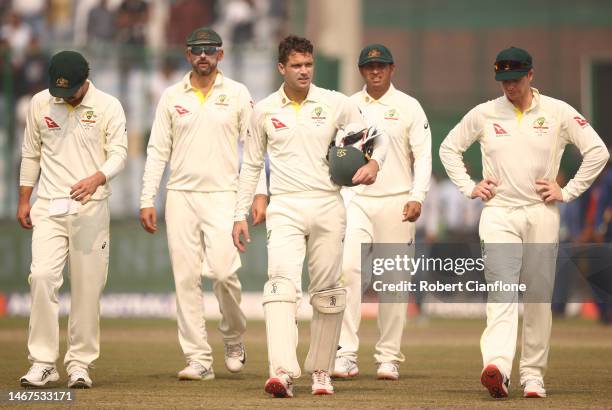 The Australian team walk off after they were defeated by India during day three of the Second Test match in the series between India and Australia at...