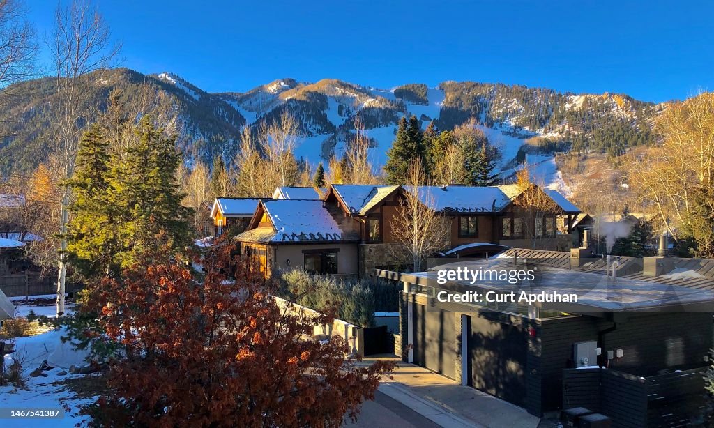 Aspen Colorado Morning Sun Illuminates Townhomes With A Blanket Of Snow On An Early Winter Morning Framed By Ajax Mountain Under Cloudless Blue Skies